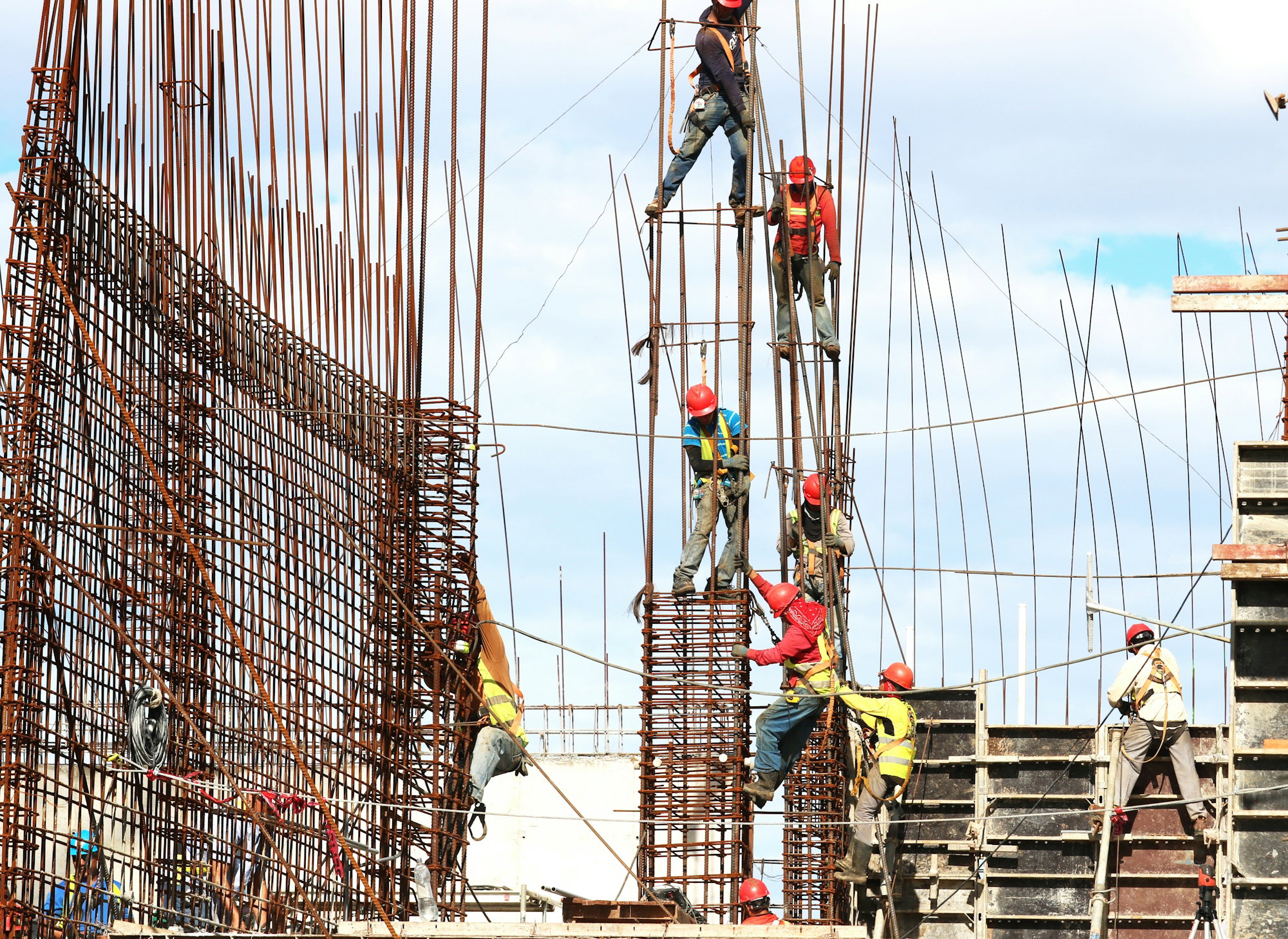 people-working-on-building-during-daytime.jpg people working on building during daytime
